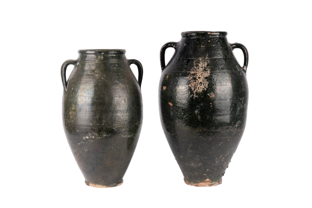 TWO VINTAGE GLAZED POTTERY VASES: Two vintage glazed pottery vases. Approximate dimensions: h. 21", w. 13", h. 11" Disclaimer: Participating bidders must have a credit card on file with LiveAuctioneers in order for their bidding regis