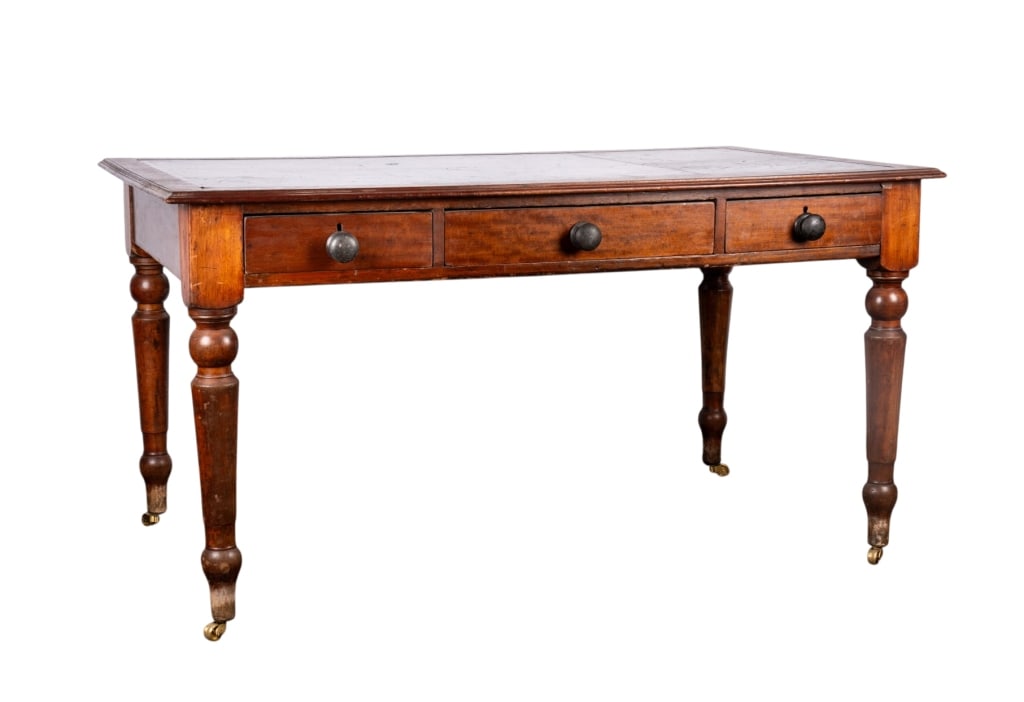 19TH C. ENGLISH MAHOGANY LIBRARY TABLE/DESK: English, 19th century. Mahogany library table/desk with castered legs and leather top. Approximate dimensions: h. 31", w. 59", d. 35" Disclaimer: Participating bidders must have a credit card on file