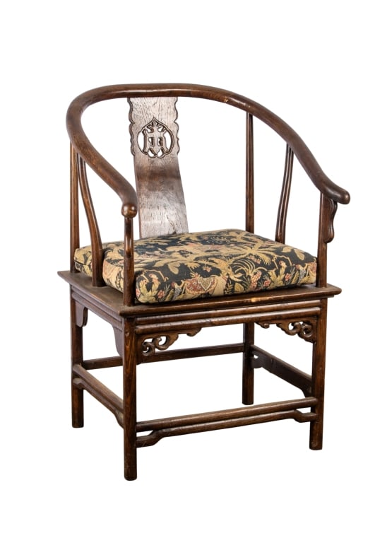 LATE QING DYNASTY CHINESE ELMWOOD HORSESHOE CHAIR: Late Qing dynasty Chinese elmwood horseshoe chair with floral upholstered cushion. Approximate dimensions: h. 35.5", w. 23", d. 22" Disclaimer: Participating bidders must have a credit card on file