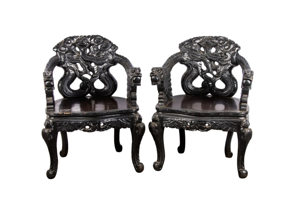 PAIR OF CHINESE HAND CARVED ARMCHAIRS: Pair of Chinese hand carved armchairs with dragon motif and intricate carving throughout. Approximate dimensions: h. 33", w. 25", d. 17" Disclaimer: Participating bidders must have a credit card on