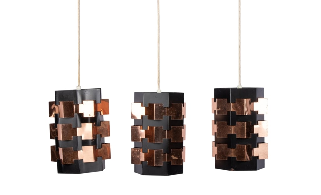 MCM HOLM SORENSEN BLACK & COPPER PENDANT LIGHTS: Three Mid-century Modern Holm Sorensen black pendant lights with geometric copper accents. Approximate dimensions: h. 10", w. 8", d. 8" Disclaimer: Participating bidders must have a credit card on