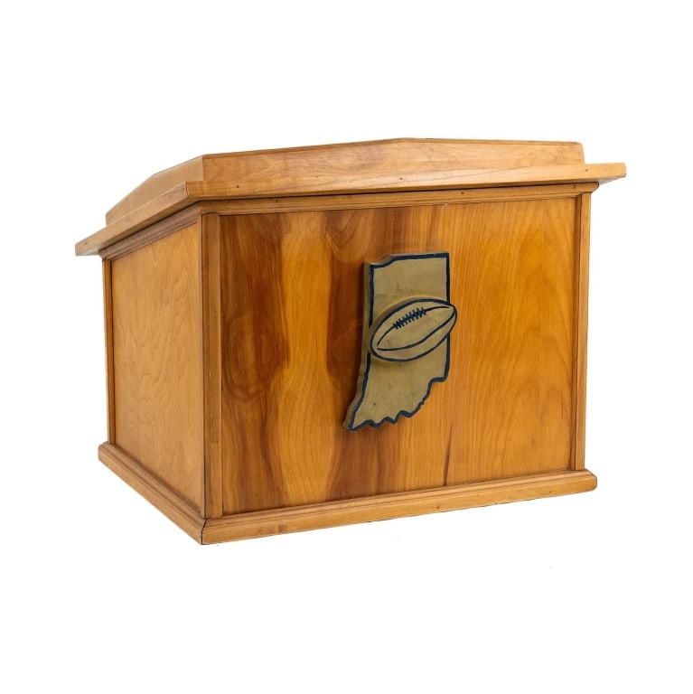 INDIANA FOOTBALL HALL OF FAME PODIUM: Indiana Football Hall of Fame podium. Two storage shelves built into the interior, and featuring a carved painted wood plaque of the Indiana Football Hall of Fame. Approximate dimensions: h. 17.5",