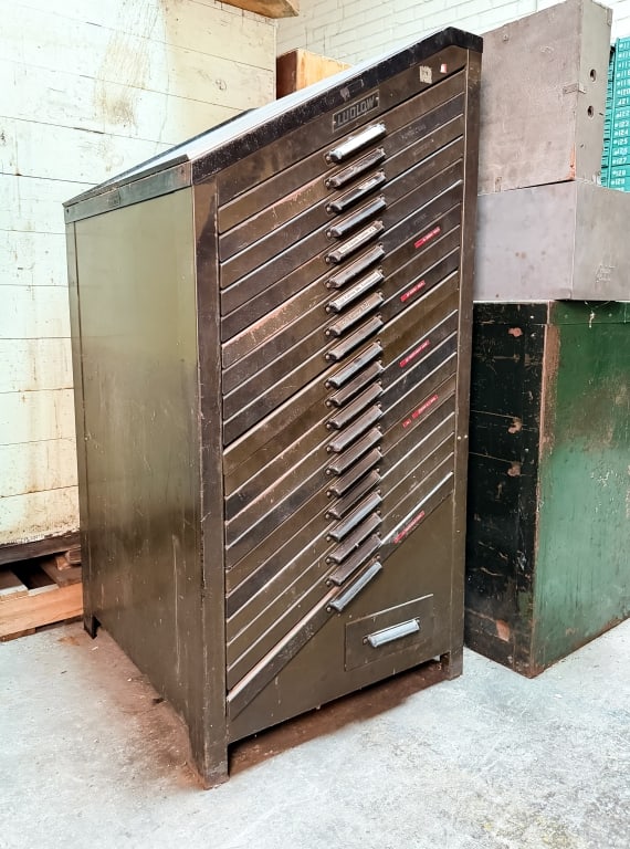 VINTAGE LUDLOW LETTERPRESS TYPESET CABINET: Vintage Ludlow letterpress typeset tray cabinet. Approximate dimensions: h. 57", w. 26.75", d. 30" Disclaimer: Participating bidders must have a credit card on file with LiveAuctioneers in order for