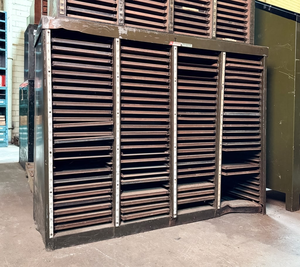 HAMILTON INDUSTRIAL LETTERPRESS CABINET: Hamilton industrial letterpress cabinet. Approximate dimensions: h. 38.5", w. 49", d. 17" Disclaimer: Participating bidders must have a credit card on file with LiveAuctioneers in order for their