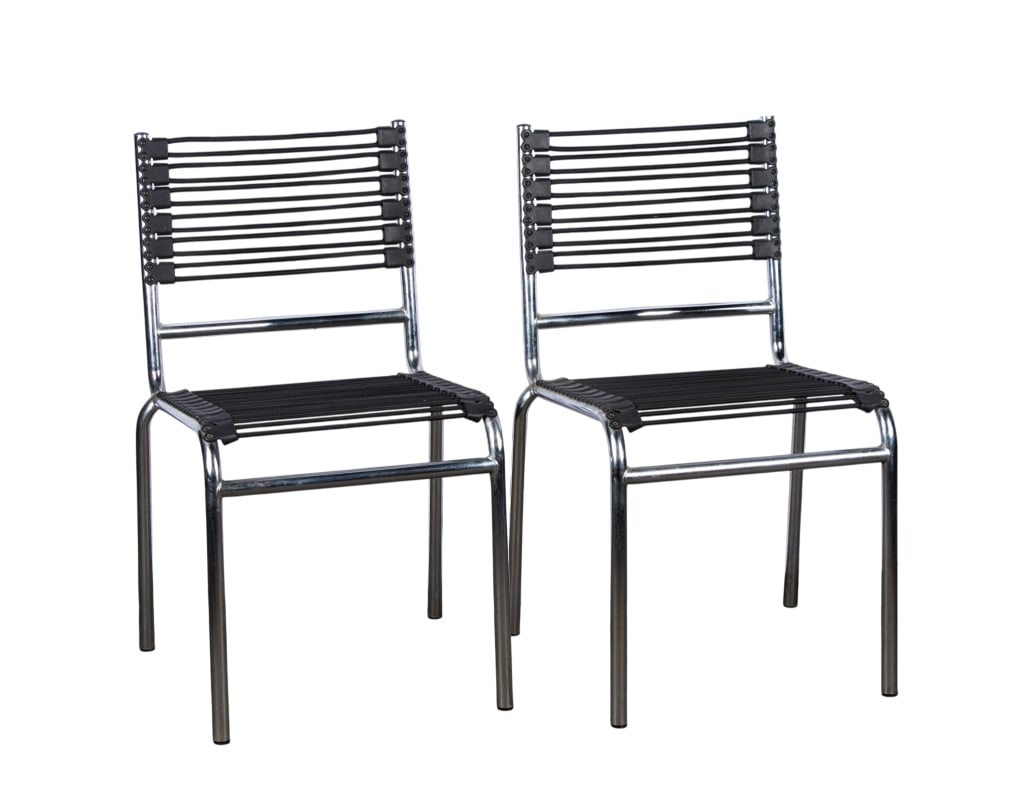 PAIR OF RENE HERBST STYLE DINING CHAIRS: Pair of Rene Herbst style dining chairs. Approximate dimensions: h. 34", w. 21", d. 20" Disclaimer: Participating bidders must have a credit card on file with LiveAuctioneers in order for their