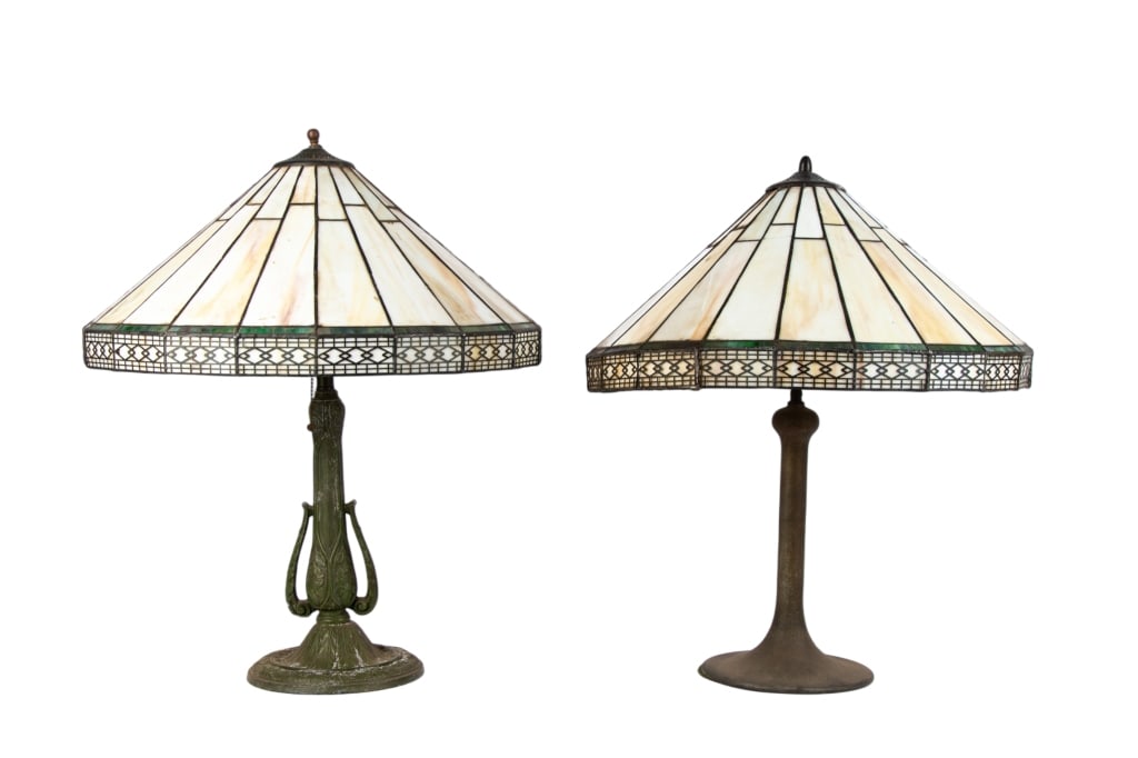 TWO TIFFANY STYLE METAL BASE TABLE LAMPS: Two Tiffany style metal base table lamps. Approximate dimensions: h. 25.5", dia. 7.5" Disclaimer: Participating bidders must have a credit card on file with LiveAuctioneers in order for their bidding 