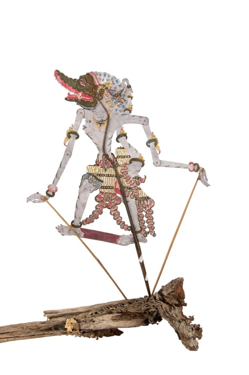 INDONESIAN KAPI SROWO SURAKARTA SHADOW PUPPET: Indonesian Java Wayang Kulit Kapi Srowo Surakarta shadow puppet. Approximate dimensions: h. 28", w. 9" Disclaimer: Participating bidders must have a credit card on file with LiveAuctioneers in order