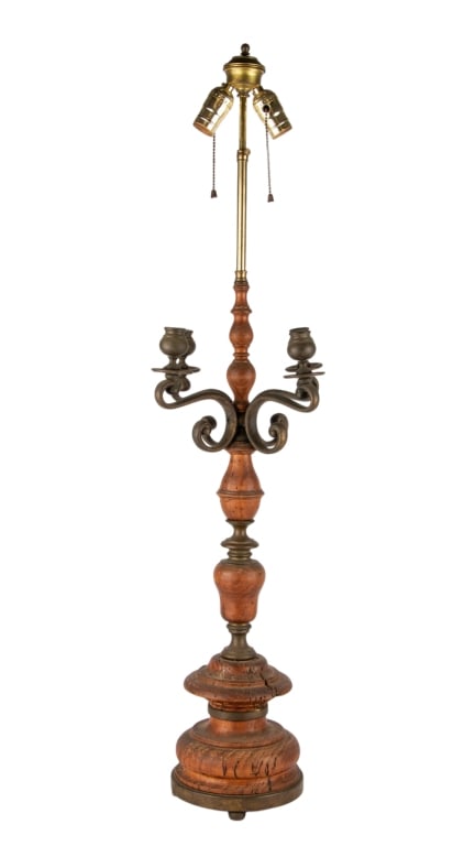 DOUBLE BULB WOOD CANDELABRA TABLE LAMP: Double bulb wood candelabra table lamp with bronze elements. Approximate dimensions: h. 40", w. 9", d. 9" Disclaimer: Participating bidders must have a credit card on file with LiveAuctioneers in