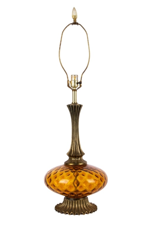 MID CENTURY BRASS & AMBER GLASS TABLE LAMP: Mid-century brass and amber glass table lamp. Approximate dimensions: h. 23.5", dia. 11" Disclaimer: Participating bidders must have a credit card on file with LiveAuctioneers in order for their