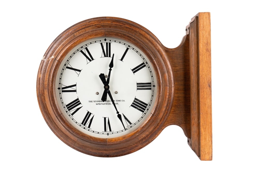 STANDARD ELECTRIC TIME CO. PUBLIC CLOCK: Standard Electric Time Co public clock with mounting bracket and oak case. Approximate dimensions: h. 17", w. 20.5", d. 7" Disclaimer: Participating bidders must have a credit card on file with