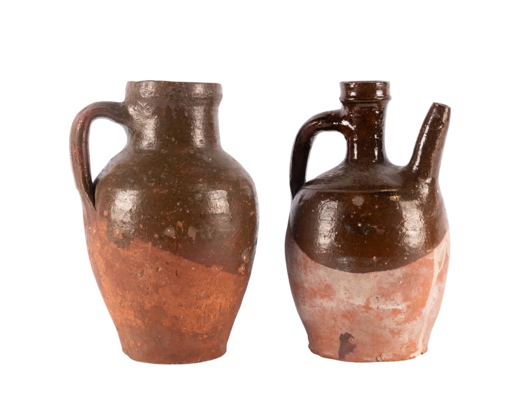 TWO FRENCH POTTERY JUGS: Two French pottery jugs. Approximate dimensions: largest h. 10", w. 7.5", d. 6" Disclaimer: Participating bidders must have a credit card on file with LiveAuctioneers in order for their bidding