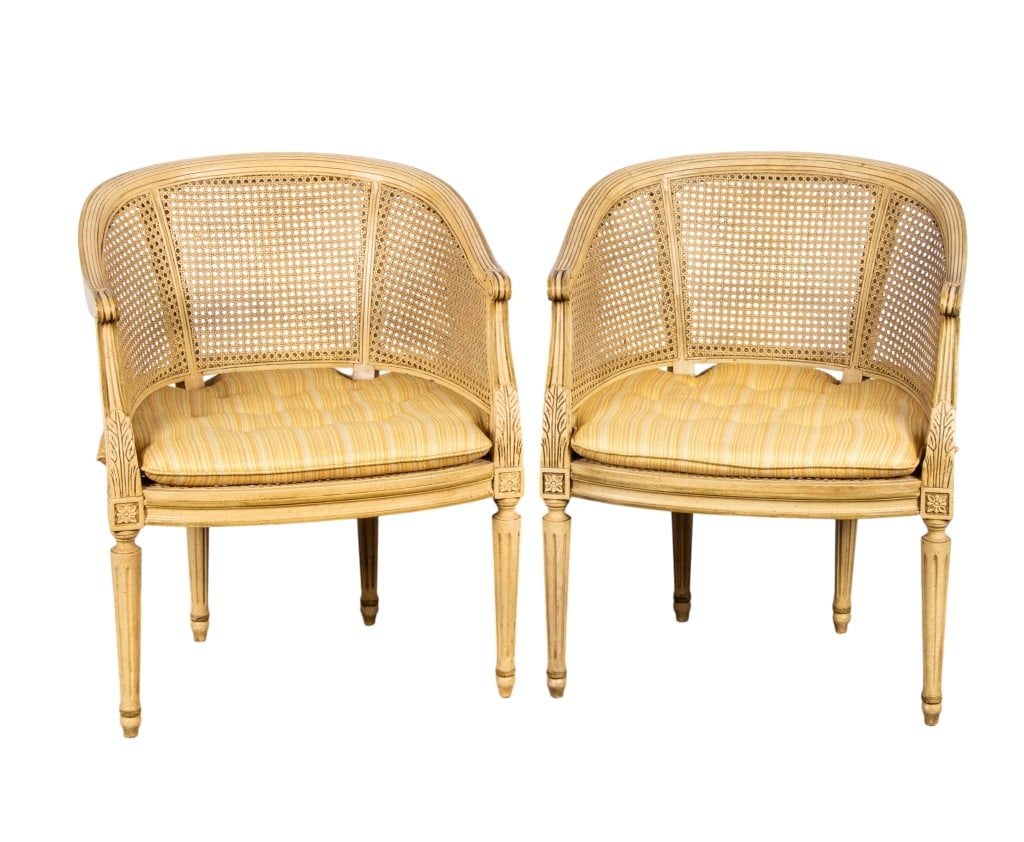 PAIR OF LOUIS XVI STYLE OCCASIONAL CHAIRS: Pair of Louis XVI style occasional chairs with barrel backs, fluted legs, cane backs and seats. Approximate dimensions: h. 32", w. 24", d. 20" Disclaimer: Participating bidders must have a credit card