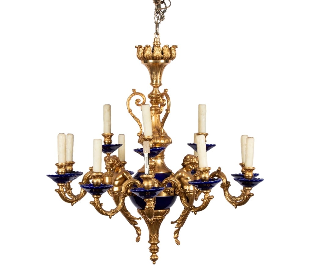 ITALIAN GILT BRONZE PUTTI CHANDELIER: Italian gilt bronze putti chandelier with blue porcelain details. Approximate dimensions: h. 30", dia. 30" Disclaimer: Participating bidders must have a credit card on file with LiveAuctioneers in ord