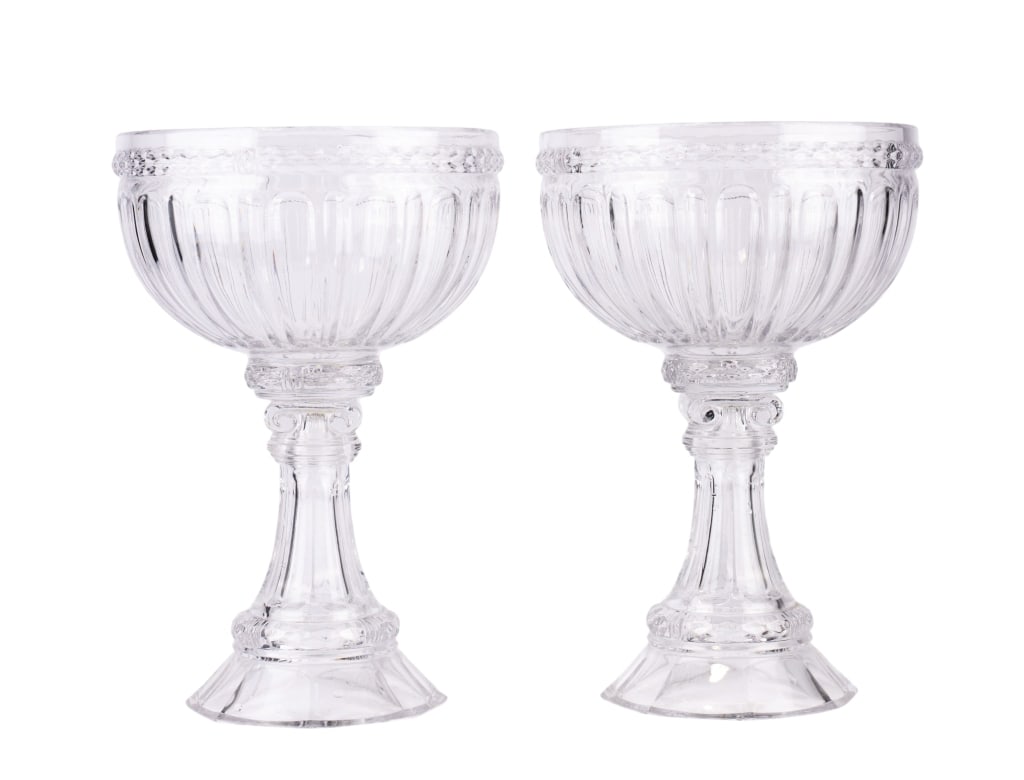 LARGE FLUTED GREEK STYLE GLASS COMPOTE PAIR: Large fluted Greek style glass compote pair. Approximate dimensions: h. 13.75", dia. 9" Disclaimer: Participating bidders must have a credit card on file with LiveAuctioneers in order for their biddin