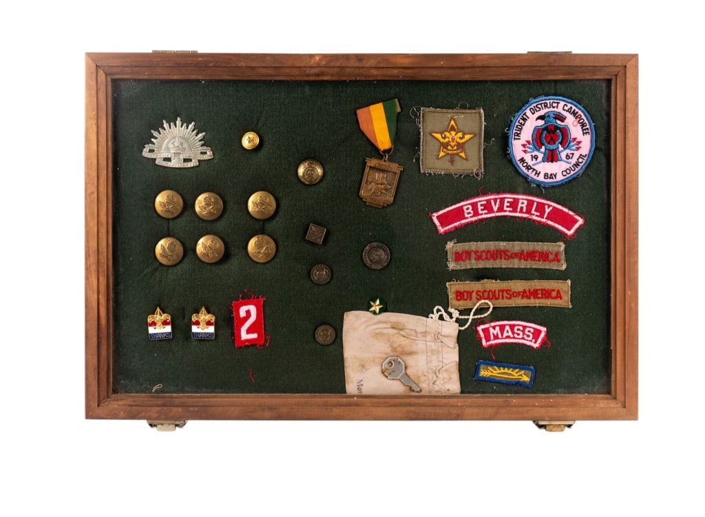 COLLECTION OF BOY SCOUT MEMORABILIA: Collection of Boy Scout memorabilia. Approximate dimensions: h. 2", w. 18", d. 12" Disclaimer: Participating bidders must have a credit card on file with LiveAuctioneers in order for their bidding