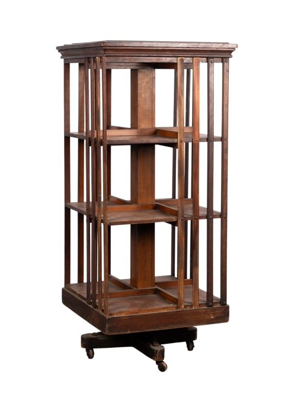 MAHOGANY REVOLVING BOOKCASE: Mahogany revolving bookcase. Approximate dimensions: h. 45.75", w. 20", d. 20" Disclaimer: Participating bidders must have a credit card on file with LiveAuctioneers in order for their bidding
