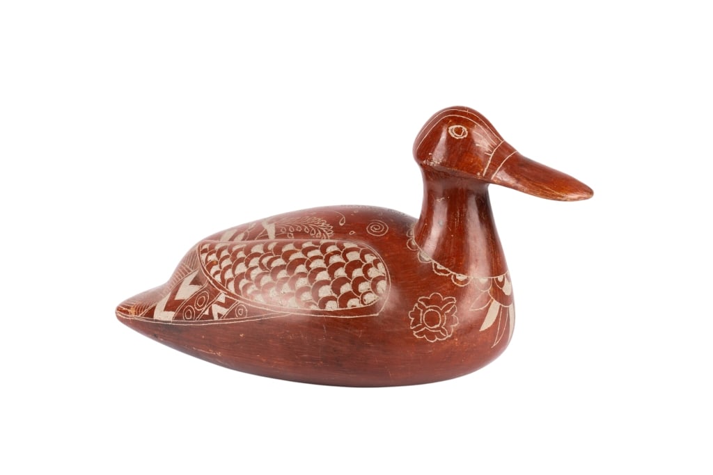 SOUTHWESTERN SGRAFFITO POTTERY DUCK: Southwestern sgraffito pottery duck. Approximate dimensions: h. 9", w. 15", d. 8" Disclaimer: Participating bidders must have a credit card on file with LiveAuctioneers in order for their bidding