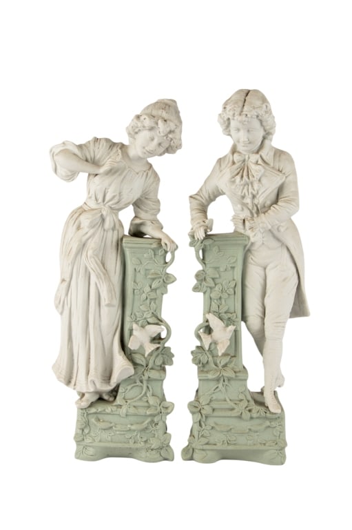 PAIR OF PARIAN WARE FIGURES: Pair of Parian ware figures male and female resting against pedestals, marked. Approximate dimensions: h. 14", w. 5", d. 3.5" Disclaimer: Participating bidders must have a credit card on file with