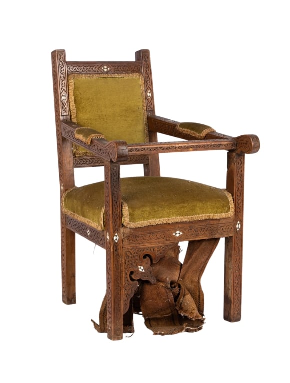 MOROCCAN BONE INLAID CARVED CHILD’S CHAIR: Moroccan bone inlaid carved child’s chair. Approximate dimensions: h. 23.25", w. 13.5", d. 17" Disclaimer: Participating bidders must have a credit card on file with LiveAuctioneers in order for