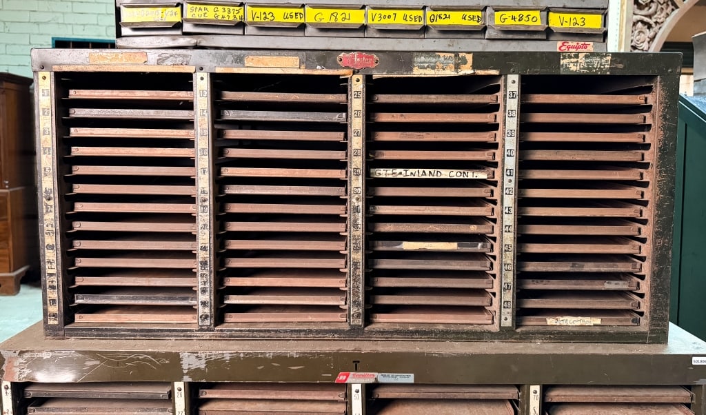 FOSTER TYPESETTER’S METAL CABINET: Foster typesetter’s metal cabinet. Approximate dimensions: h. 20", w. 43.5", d. 14.5" Disclaimer: Participating bidders must have a credit card on file with LiveAuctioneers in order for their