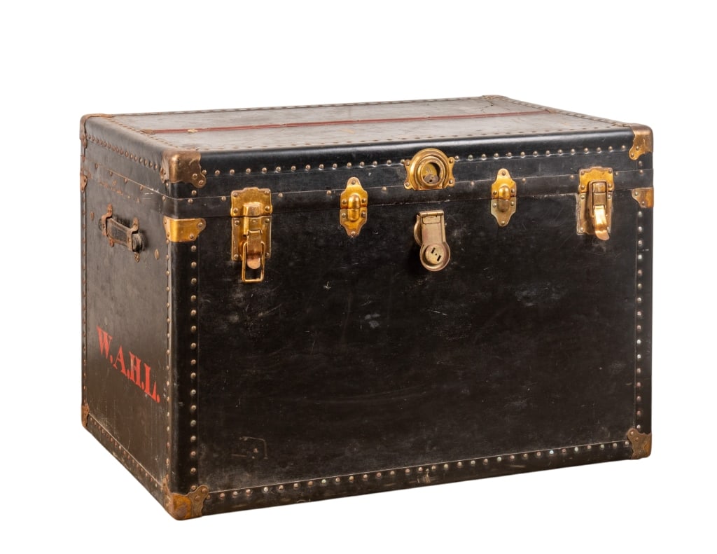 VINTAGE TRAVEL TRUNK: Vintage travel trunk with nailhead trim accents. Monogrammed W.A.H.L. to the side. Approximate dimensions: h. 24", w. 36", d. 22" Disclaimer: Participating bidders must have a credit card on file