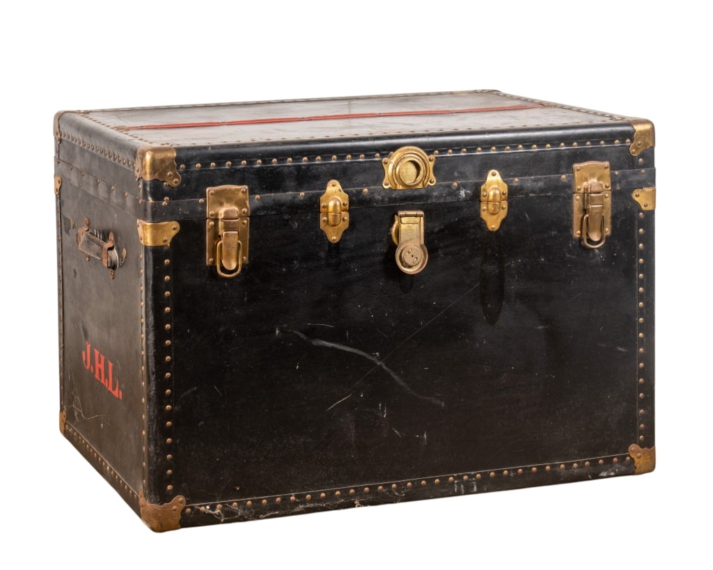 VINTAGE TRAVEL TRUNK: Vintage travel trunk with nailhead trim accents. Monogrammed J.H.L. to the side. Approximate dimensions: h. 24.5", w. 36", d. 22.5" Disclaimer: Participating bidders must have a credit card on file