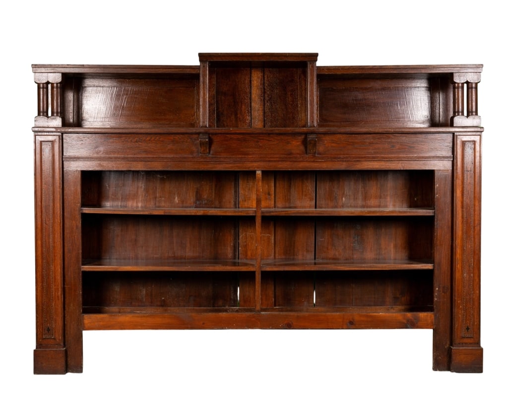 EARLY 20TH CENTURY ENGLISH LIBRARY BOOKCASE: Early 20th century English library bookcase with column supports. Approximate dimensions: h. 59.25", w. 83", d. 11" Disclaimer: Participating bidders must have a credit card on file with