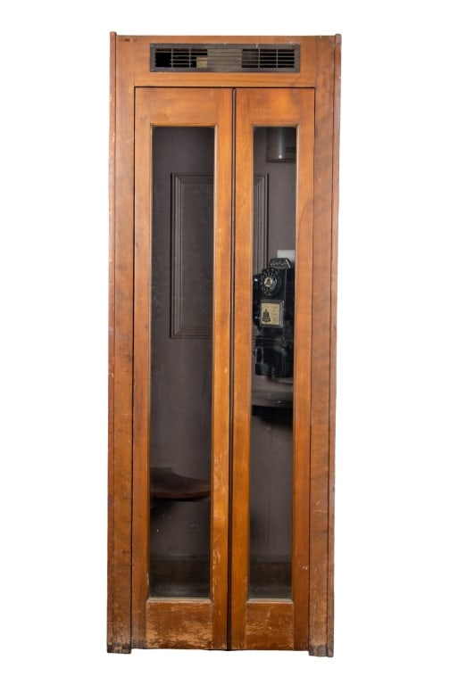 VINTAGE AUTOMATIC ELECTRIC CO. TELEPHONE BOOTH: Vintage Automatic Electric Co. telephone booth. Approximate dimensions: h. 83.5", w. 30.5", d. 30.5" Disclaimer: Participating bidders must have a credit card on file with LiveAuctioneers in order