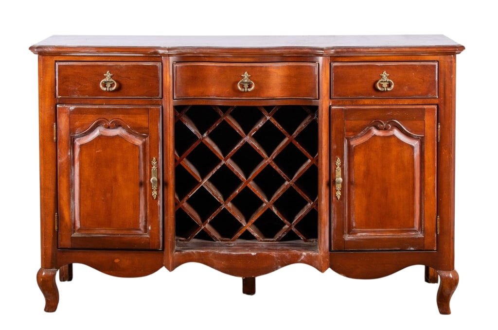 MODERN BAR CABINET: Modern bar cabinet with carved apron, inset carved panels and brass pulls. Approximate dimensions: h. 38", w. 60", d. 18.5" Disclaimer: Participating bidders must have a credit card on file with