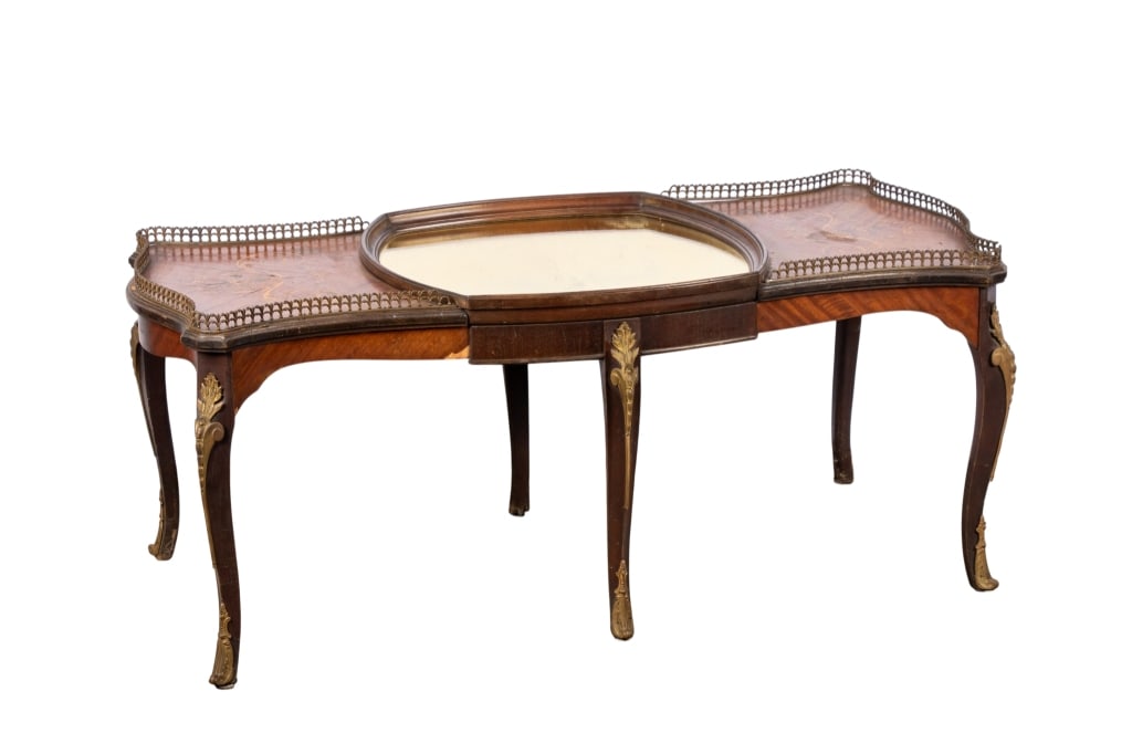 FRENCH LOUIS XVI STYLE MARQUETRY COFFEE TABLE: French Louis XVI style marquetry coffee table with floral marquetry accents, pierced gallery, brass appliques to legs, and mirrored top. Approximate dimensions: h. 18", w. 44", d. 21" Disclaimer: