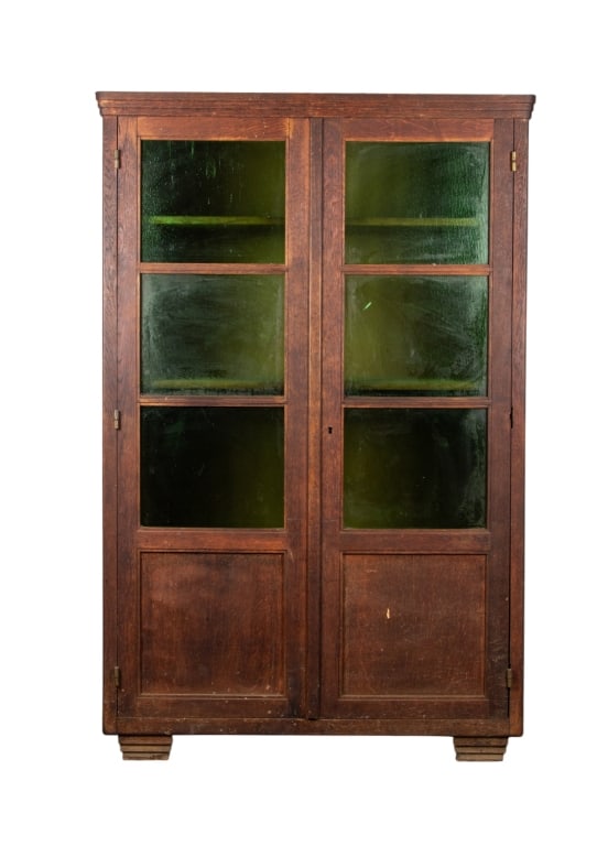 ARTS & CRAFTS DISPLAY CABINET: Arts and Crafts display cabinet with emerald glass panels. Approximate dimensions: h. 74.5", w. 48", d. 22.5" Disclaimer: Participating bidders must have a credit card on file with LiveAuctioneers in