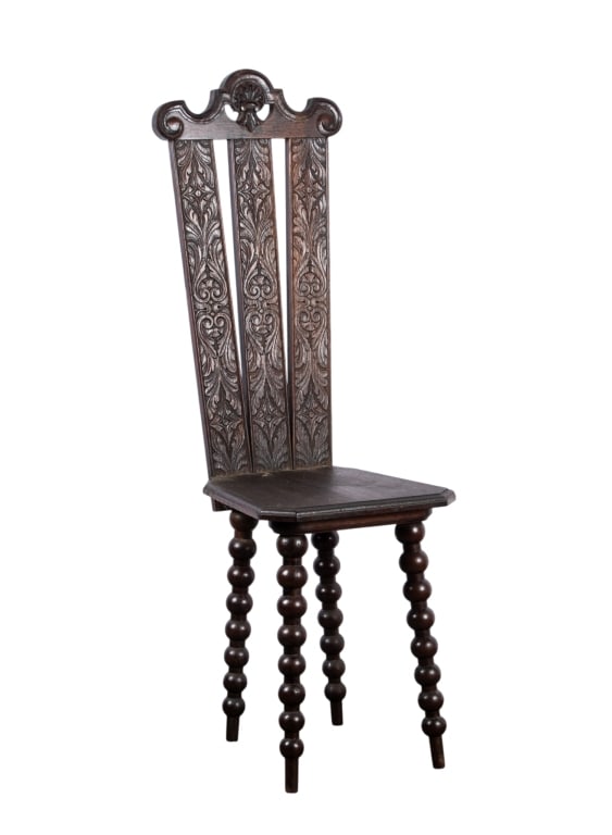 SPANISH COLONIAL STYLE CARVED SIDE CHAIR: Spanish Colonial style carved side chair with turned splayed legs and intricately carved back. Approximate dimensions: h. 44", w. 14", d. 16" Disclaimer: Participating bidders must have a credit card
