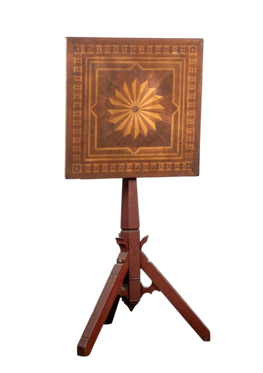 19TH CENTURY AMERICAN INLAID TILT TOP TABLE: 19th century American inlaid tilt top table with carved base. Approximate dimensions: h. 30", w. 18", d. 18" Disclaimer: Participating bidders must have a credit card on file with LiveAuctioneers in
