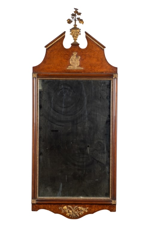 20TH CENTURY MAHOGANY WALL MIRROR: 20th century. Mahogany wall mirror with gilt accents and open pediment. Approximate dimensions: h. 50", w. 20", d. 0.75" Disclaimer: Participating bidders must have a credit card on file with