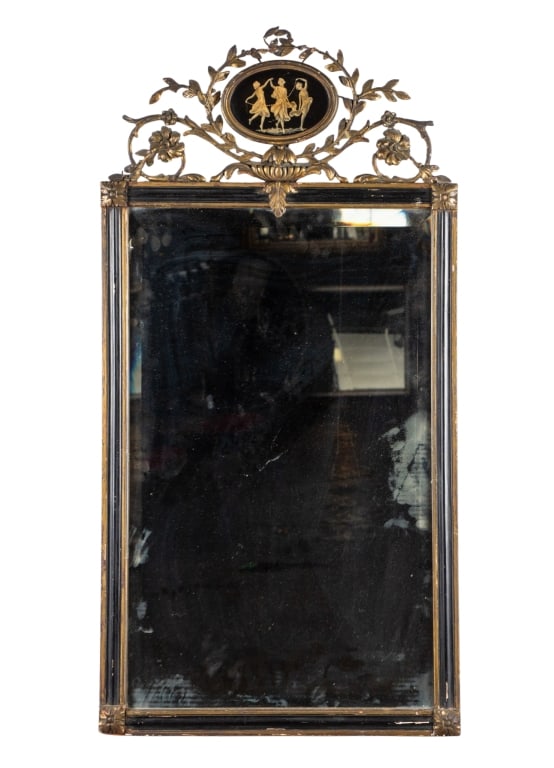 NEOCLASSICAL STYLE CARVED WALL MIRROR: Neoclassical style carved wall mirror with floral scrolling details, intricately carved accents, and hand-painted pediment. Approximate dimensions: h. 43", w. 21.5", d. 0.75" Disclaimer: