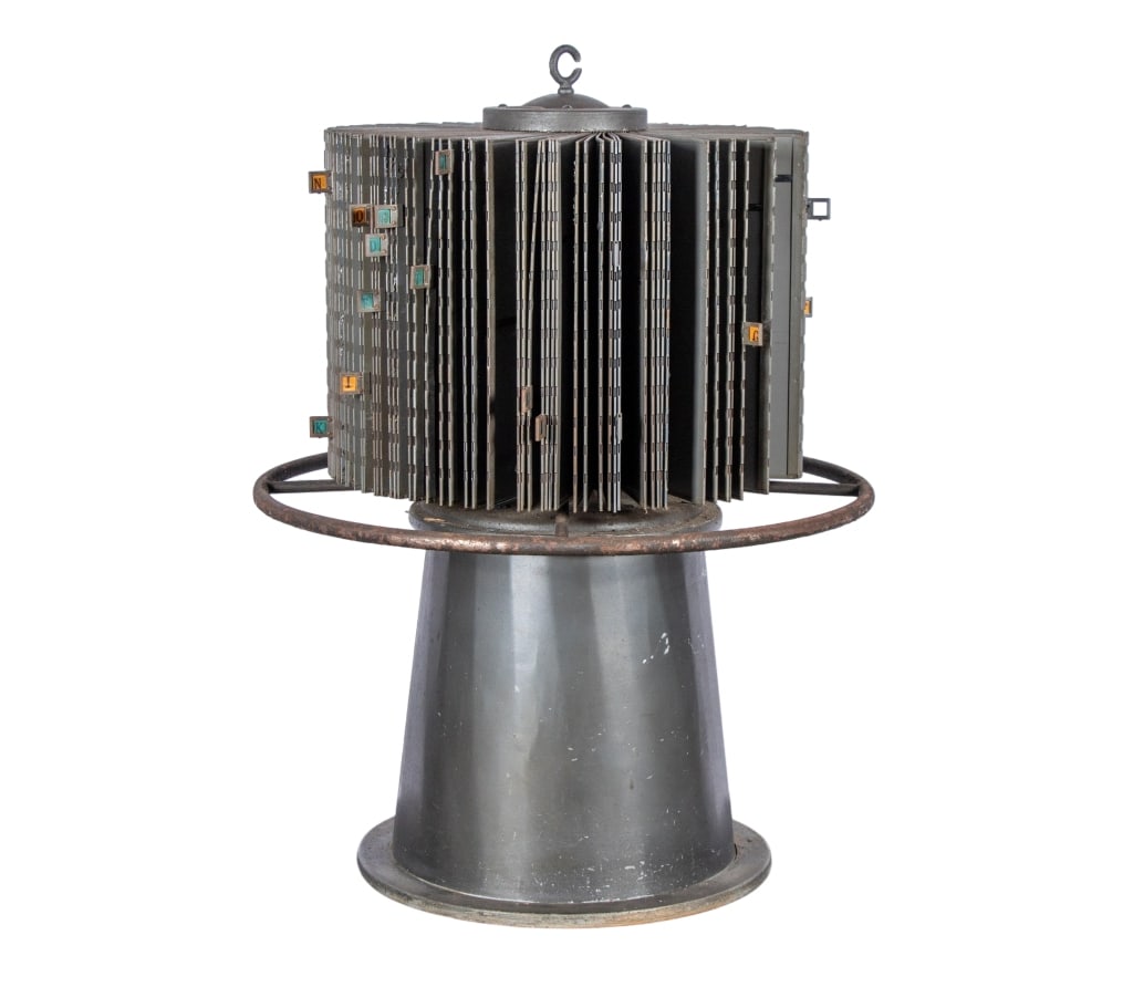VINTAGE STANDING METAL FILING CAROUSEL: Vintage standing metal filing carousel. Approximate dimensions: h. 32", dia. 26" Disclaimer: Participating bidders must have a credit card on file with LiveAuctioneers in order for their bidding