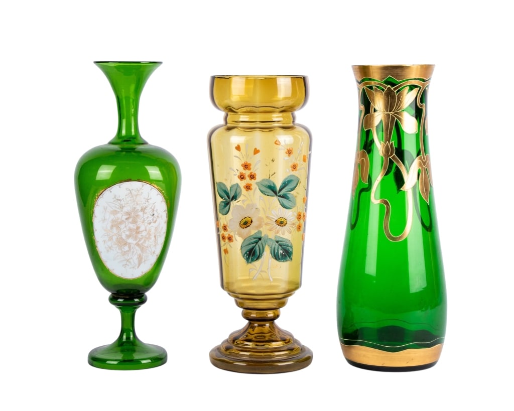 THREE MID-CENTURY HAND-PAINTED VASES: Three Mid-Century hand-painted vases with two emerald glass and one amber glass. Approximate dimensions: h. 13", dia. 5" Disclaimer: Participating bidders must have a credit card on file with