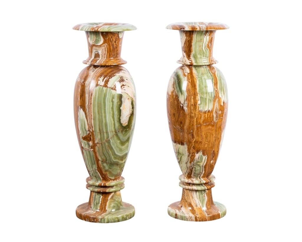 PAIR OF POLISHED ONYX FLOOR VASES: Pair of polished onyx floor vases. Approximate dimensions: h. 29.5", dia. 10" Disclaimer: Participating bidders must have a credit card on file with LiveAuctioneers in order for their bidding