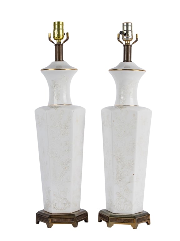 PAIR OF BLANC DE CHINE TABLE LAMPS: Pair of Blanc de Chine table lamps with floral motif and brass bases. Approximate dimensions: h. 25", w. 7", d. 7" Disclaimer: Participating bidders must have a credit card on file with