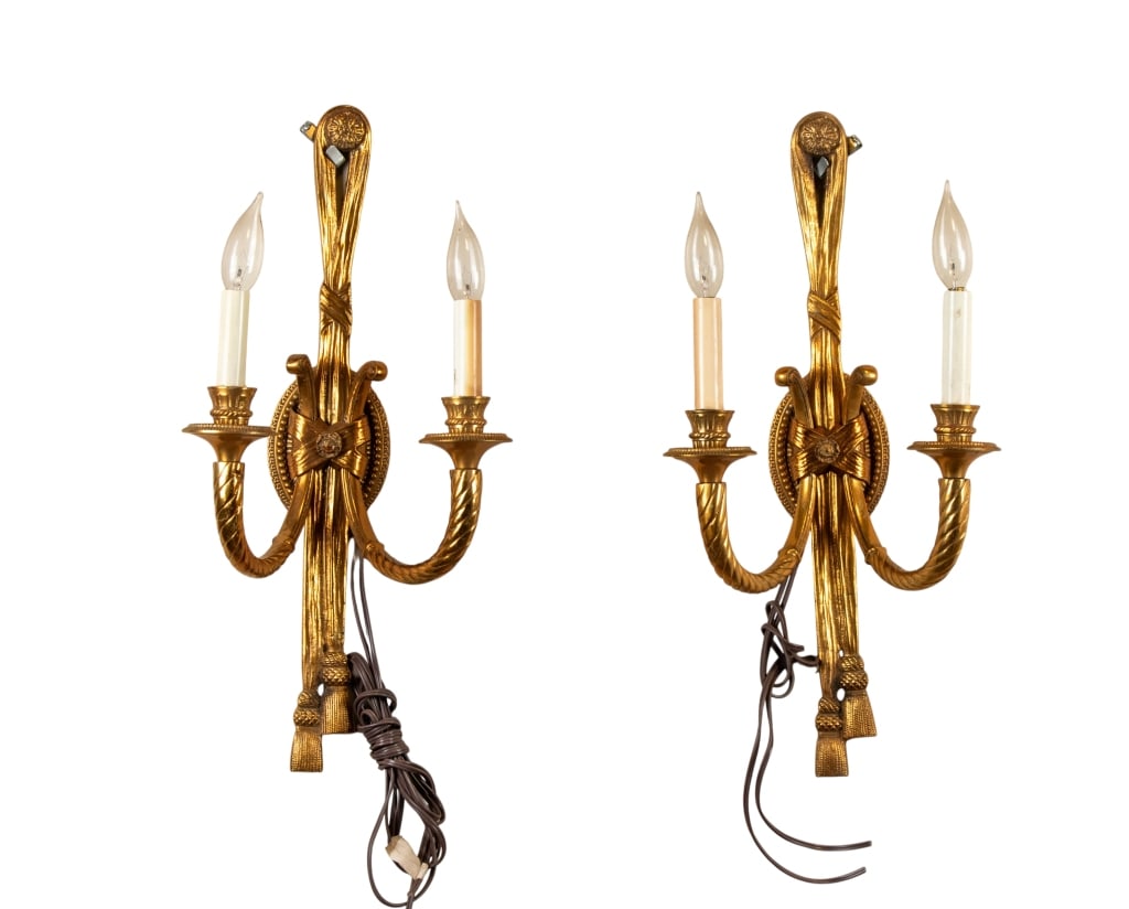 PAIR OF FRENCH REGENCY STYLE BRASS SCONCES: Pair of French Regency style brass sconces. Approximate dimensions: h. 22", w. 11", d. 8" Disclaimer: Participating bidders must have a credit card on file with LiveAuctioneers in order for their