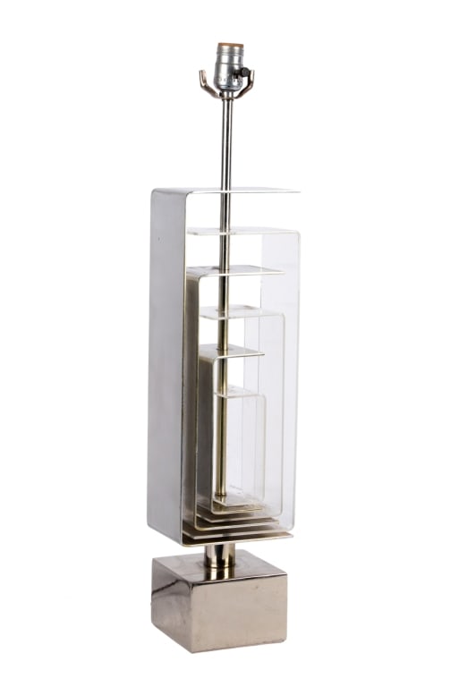 MCM LUCITE & CHROME TABLE LAMP: MCM lucite and chrome table lamp. Approximate dimensions: h. 29", w. 6", d. 4" Disclaimer: Participating bidders must have a credit card on file with LiveAuctioneers in order for their bidding