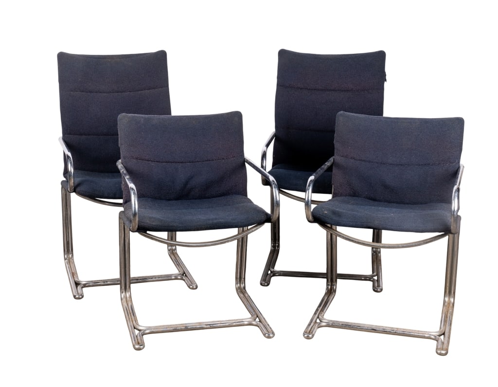 SET OF 4 MCM CHROMED CHAIRS: Set of 4 MCM chromed chairs with chromed bases and dark blue upholstery. Approximate dimensions: h. 39", w. 22", d. 24" Disclaimer: Participating bidders must have a credit card on file with