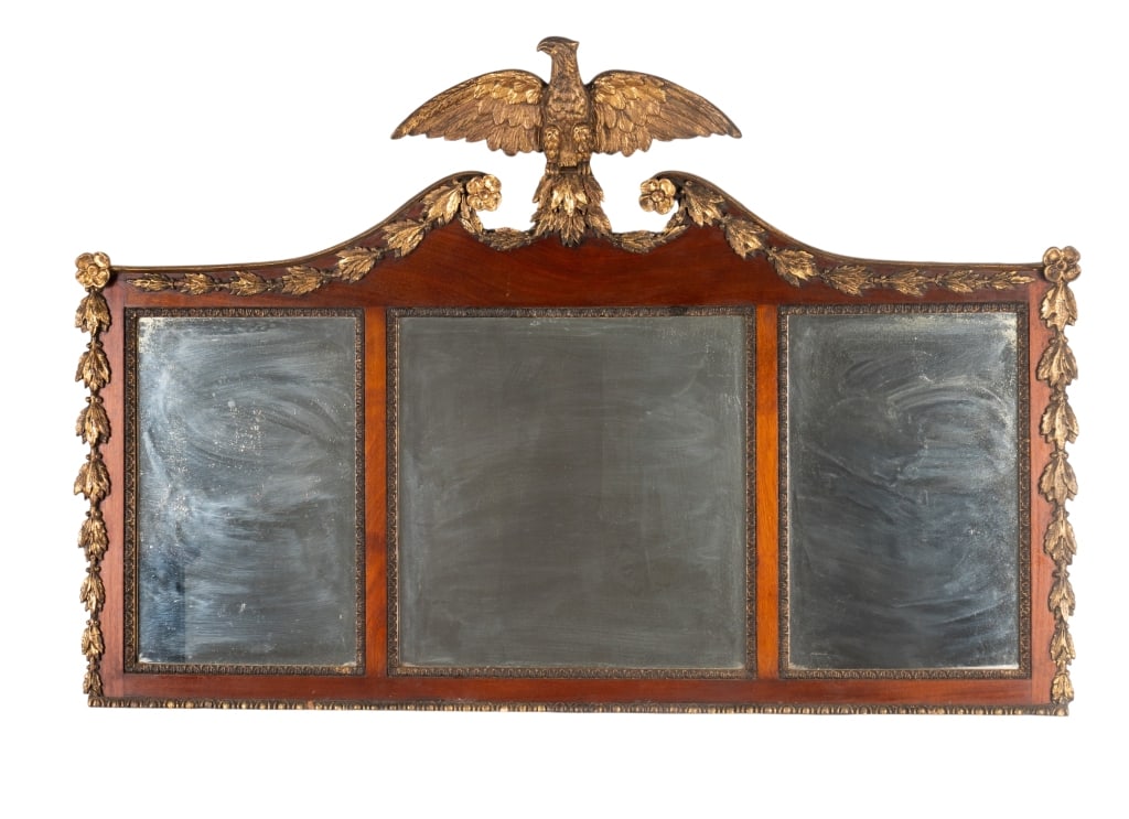FEDERAL STYLE MAHOGANY & GILTWOOD MIRROR: Federal style mahogany and giltwood overmantel mirror with triple mirrors, gilt accents, and eagle crest. Approximate dimensions: h. 32.5", w. 48.5", d. 4" Disclaimer: Participating bidders must have