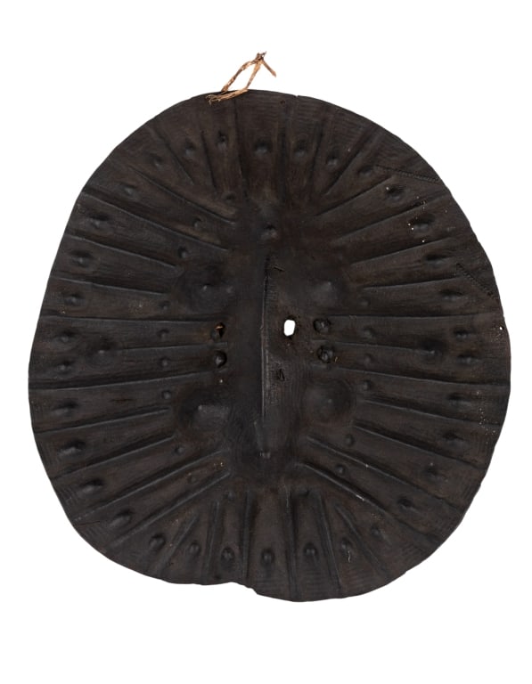 ANTIQUE ETHIOPIAN LEATHER OROMO SHIELD: Antique Ethiopian leather Oromo shield. Approximate dimensions: h. 28", w. 26", d. 3.5" Disclaimer: Participating bidders must have a credit card on file with LiveAuctioneers in order for their