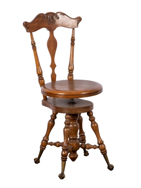 19TH CENTURY MAHOGANY BALL & CLAW FOOT PIANO STOOL: 19th century. Mahogany ball and claw foot piano stool with carved stretcher base, turned legs, and adjustable seat. Approximate dimensions: h. 36", w. 16", d. 16" Disclaimer: Participating bidders