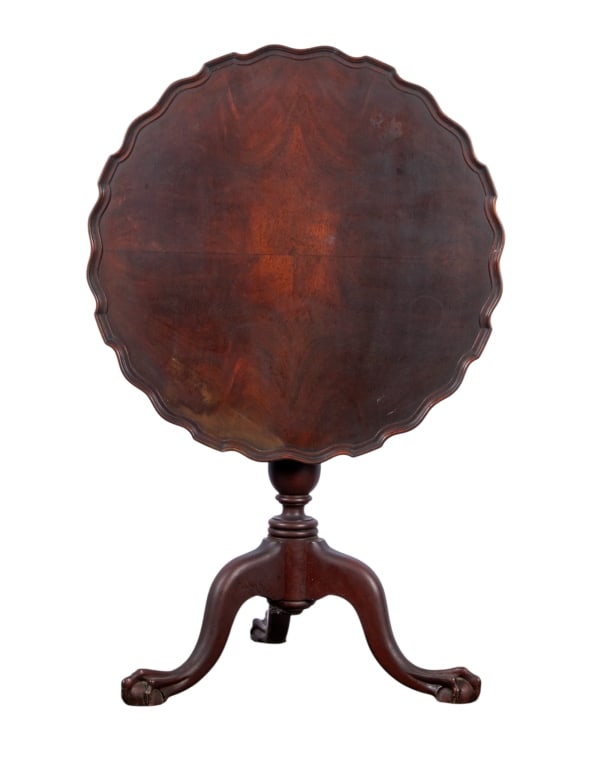 CHIPPENDALE STYLE MAHOGANY TILT TOP TABLE: Chippendale style mahogany tilt top table with ball and claw feet and carved base. Approximate dimensions: h. 29", dia. 28" Disclaimer: Participating bidders must have a credit card on file with LiveA