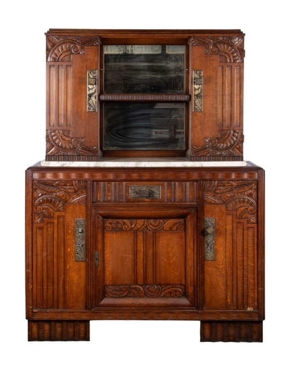 ART DECO STYLE MARBLE TOP CUPBOARD: Art Deco style marble top cupboard with inset carved panels, metal square pulls, and mirrored backsplash. Approximate dimensions: h. 74", w. 57", d. 18" Disclaimer: Participating bidders must have a c