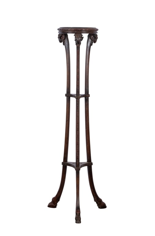 20TH CENTURY MAHOGANY PLANT STAND: 20th century mahogany plant stand with hoof feet and ram head supports. Approximate dimensions: h. 50.5", dia 17" Disclaimer: Participating bidders must have a credit card on file with