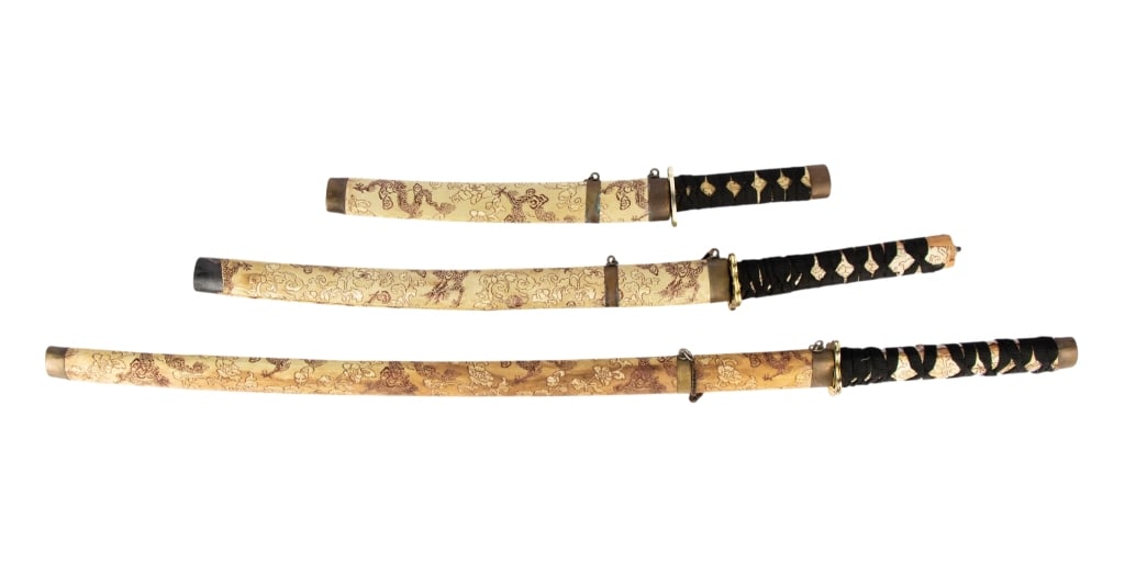THREE ASIAN PROP SWORDS: Three Asian prop swords. Approximate dimensions: h. 36.5", w. 3", d. 2" Disclaimer: Participating bidders must have a credit card on file with LiveAuctioneers in order for their bidding registration