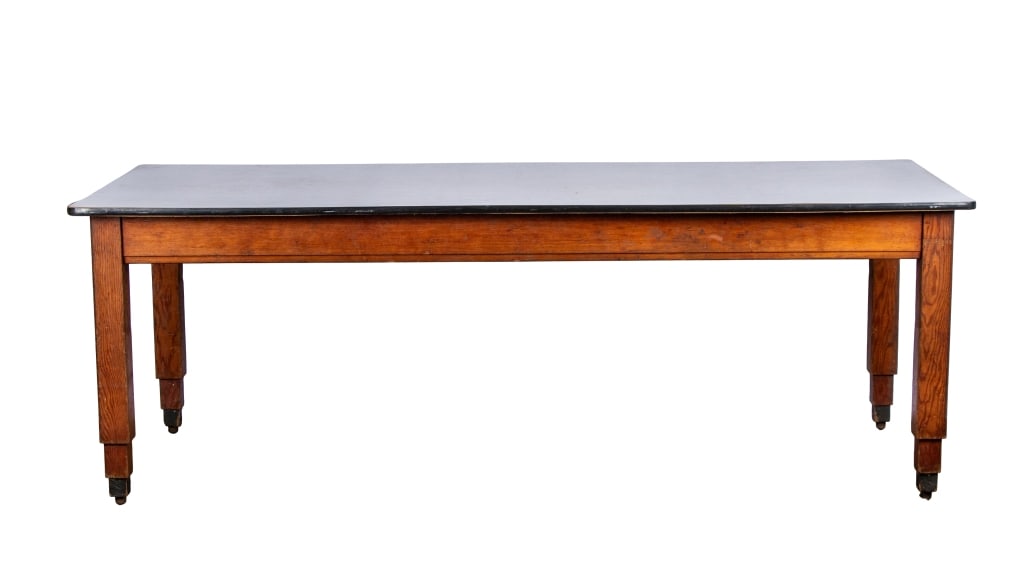 MID CENTURY DINING TABLE: castered legs Approximate dimensions: h. 31", w. 87", d. 36" Disclaimer: Participating bidders must have a credit card on file with LiveAuctioneers in order for their bidding registration to be